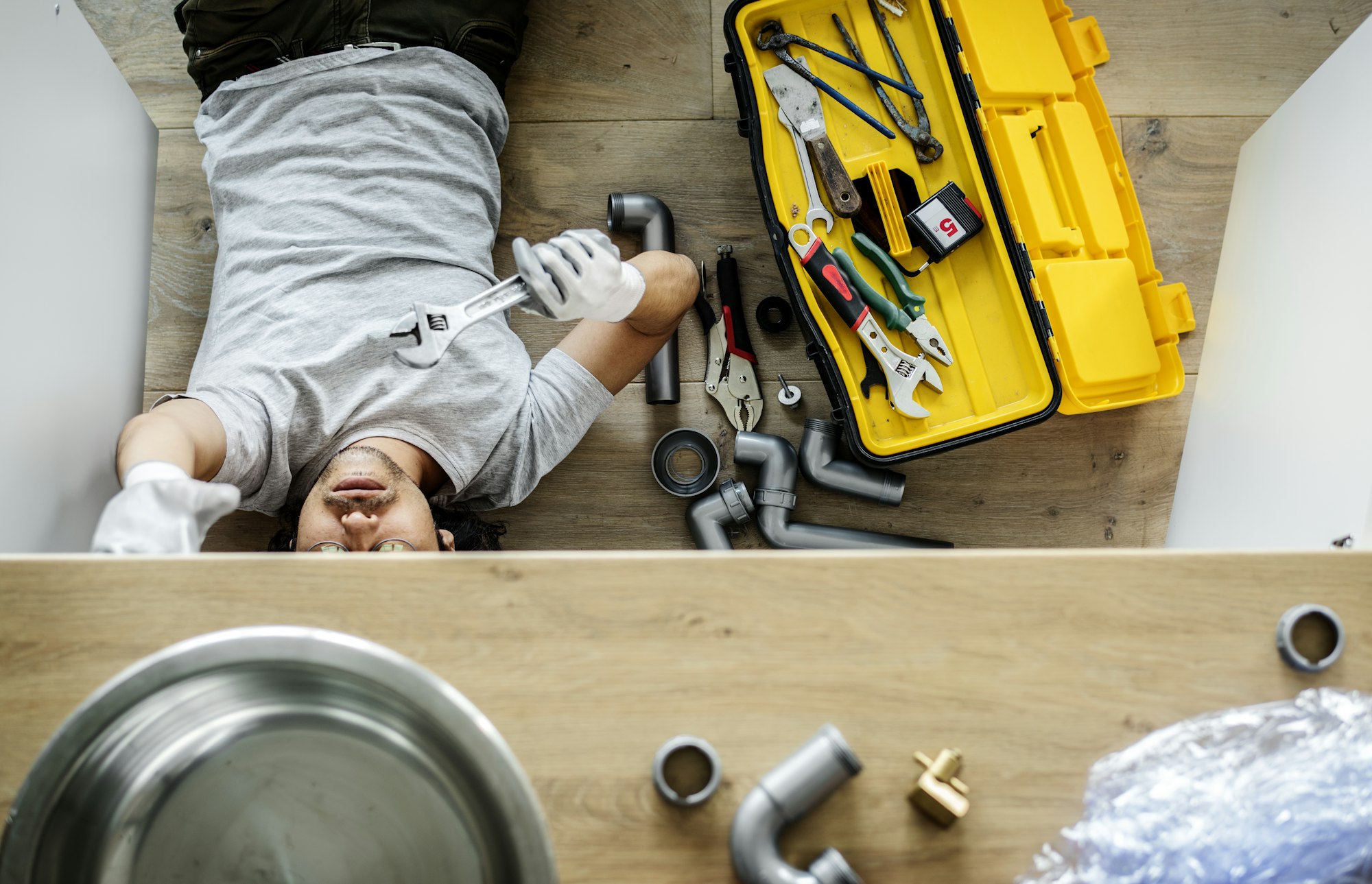 Man fixing kitchen sink